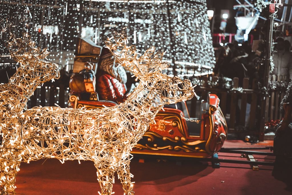 A festive scene featuring illuminated reindeer and a Santa sleigh, perfect for holiday ambiance.